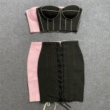 Wearing a strapless diamond studded top with drawstring bandages for a 2-piece dress set