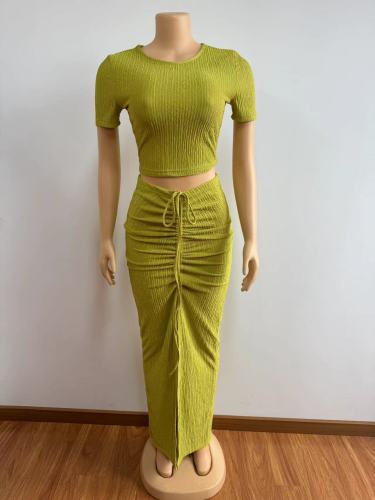 Tight pleated short sleeved top with drawstring and pleated half length skirt two-piece set