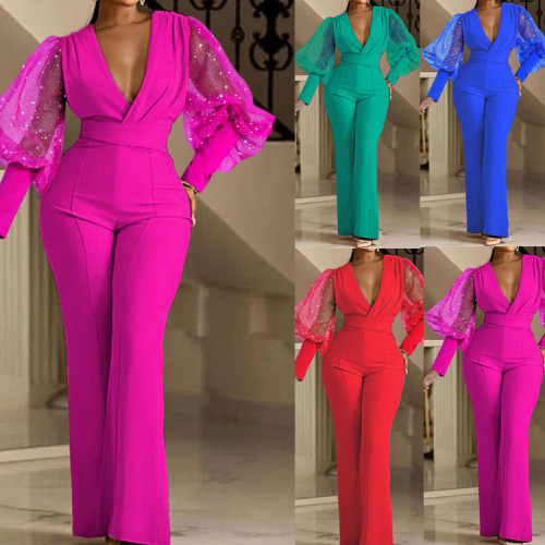 Wrinkled V-neck mesh spliced long sleeved jumpsuit