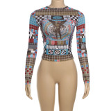 Round neck long sleeved tight fitting crop top with exposed navel