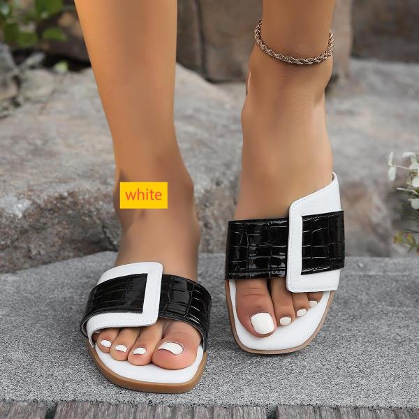 Wearing square shaped stone patterned oversized slippers outside