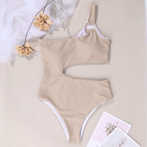 Solid color one-piece swimsuit with exposed waist and single shoulder strap