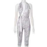 Printed hanging neck backless hollow lace up seven part jumpsuit