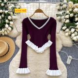 Contrast striped knit shirt with ruffled hem and flared sleeves as a base top