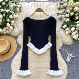 Contrast striped knit shirt with ruffled hem and flared sleeves as a base top