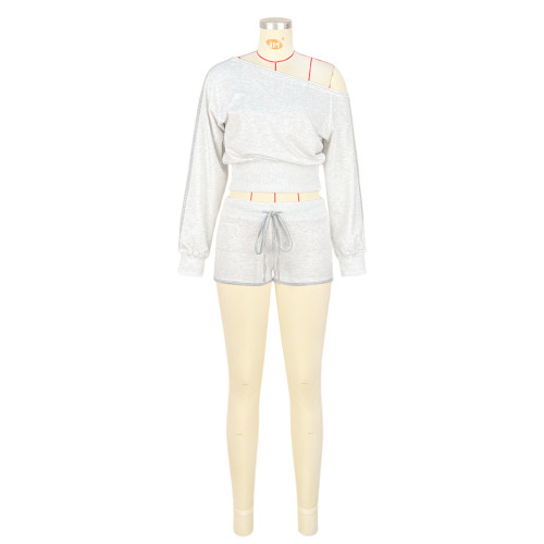 Two piece set of slanted shoulder and one shoulder strap pants