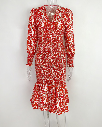 V-neck fishtail dress with waist cinch and figure-hugging silhouette