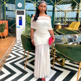 Shoulderless pleated hip hugging skirt with a one neck strapless and slightly transparent dress
