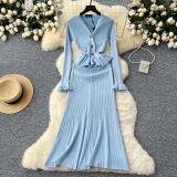 Metal buckle waist knitted long sleeved skirt
