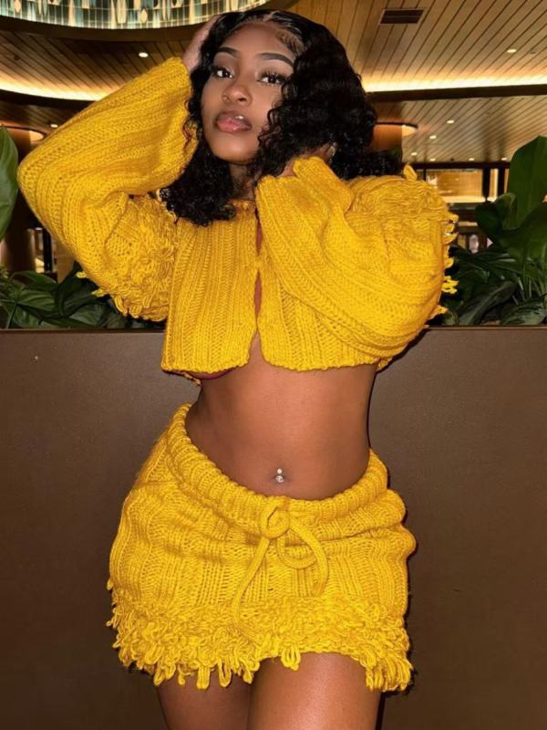 Open navel long sleeved cardigan with tassel skirt two-piece set