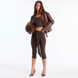 Camisole crop top with exposed navel, high waist, tied ribbon, and seven-inch pants set