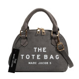 Large-capacity messenger bag with shell pattern and initials
