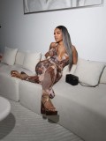 Printed neck hanging, backless waist cinched sleeveless jumpsuit