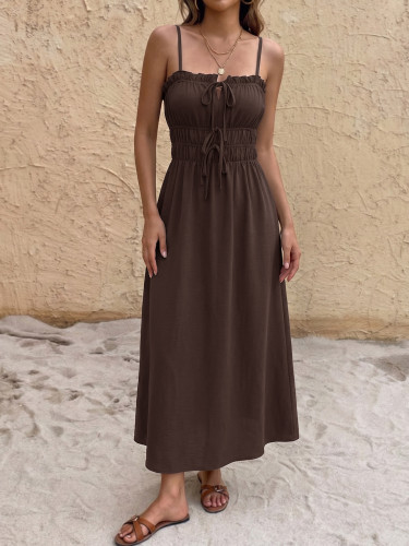 Pulling up a long dress with a single collar and suspender straps