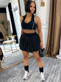 Two piece set of collared tank top lined with safety pants and pleated short skirt