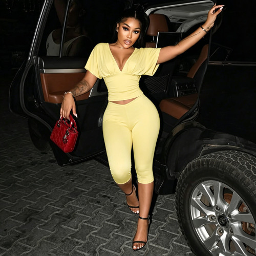 Solid color V-neck pleated half sleeved top, tight fitting cropped pants two-piece set