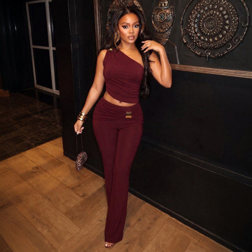 Two piece set of metal single shoulder pleated top and slightly flared pants
