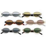 A collection of retro small frame oval sunglasses in various lens tints including grey, yellow, brown, and green with metallic silver and gold frames.