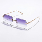 Rimless polygon sunglasses with gold metal frame and pure purple-to-clear gradient lenses