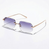 Rimless geometric sunglasses with gold metal frame and dusty purple-to-clear gradient lenses