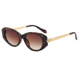 Tortoiseshell retro oval sunglasses with brown gradient lenses and gold-tone temple details, three-quarter view