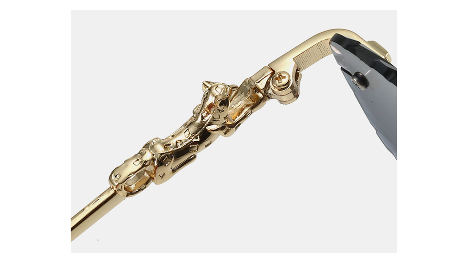 Close-up of the metal hinge and gold-tone panther temple detail