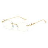 Rimless rectangular glasses with clear lenses and gold-tone panther temples