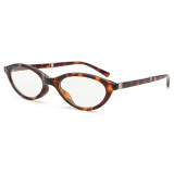 Narrow cat-eye glasses in tortoiseshell frame with clear lenses