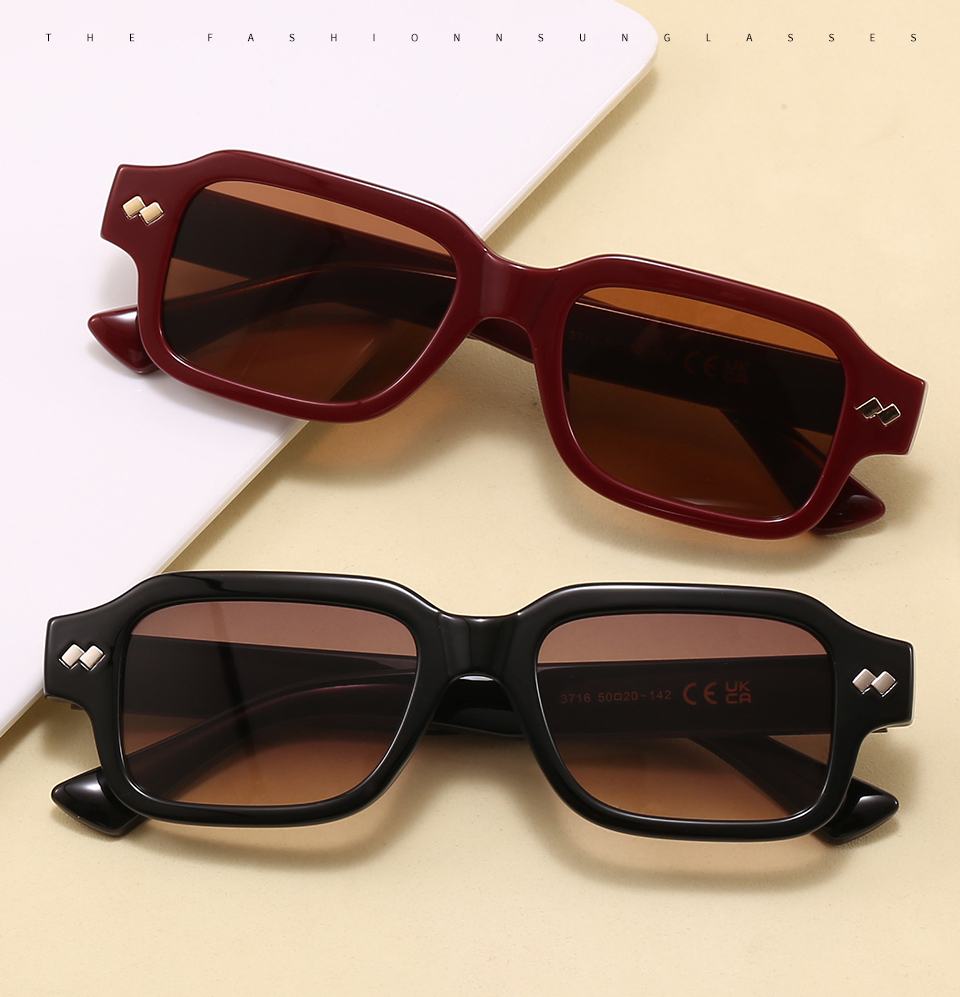 Two folded pairs in a styled tabletop display, showing the frame profile and lens colors.