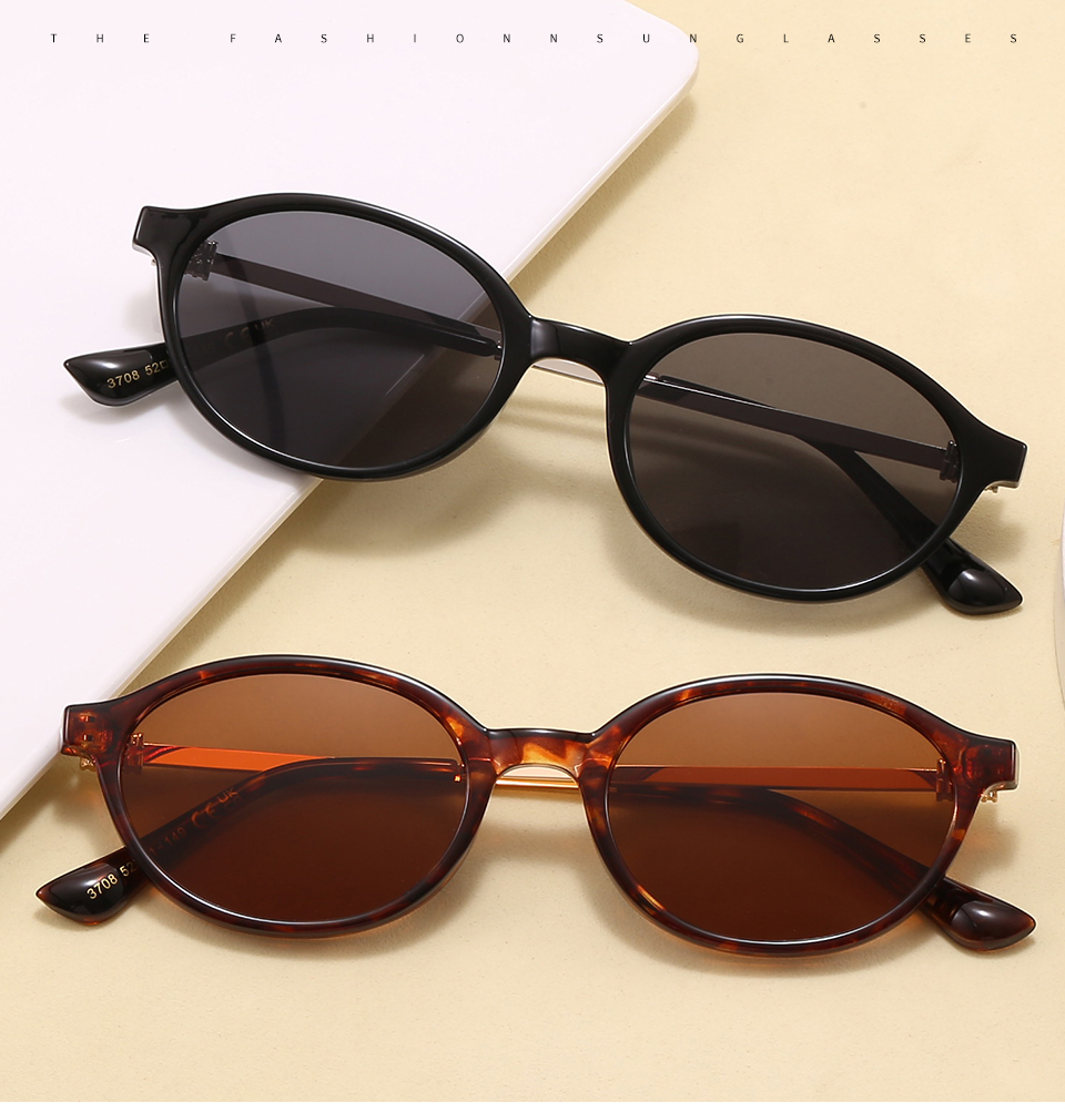 Two folded pairs in a styled tabletop display, showing the frame profile and lens colors.