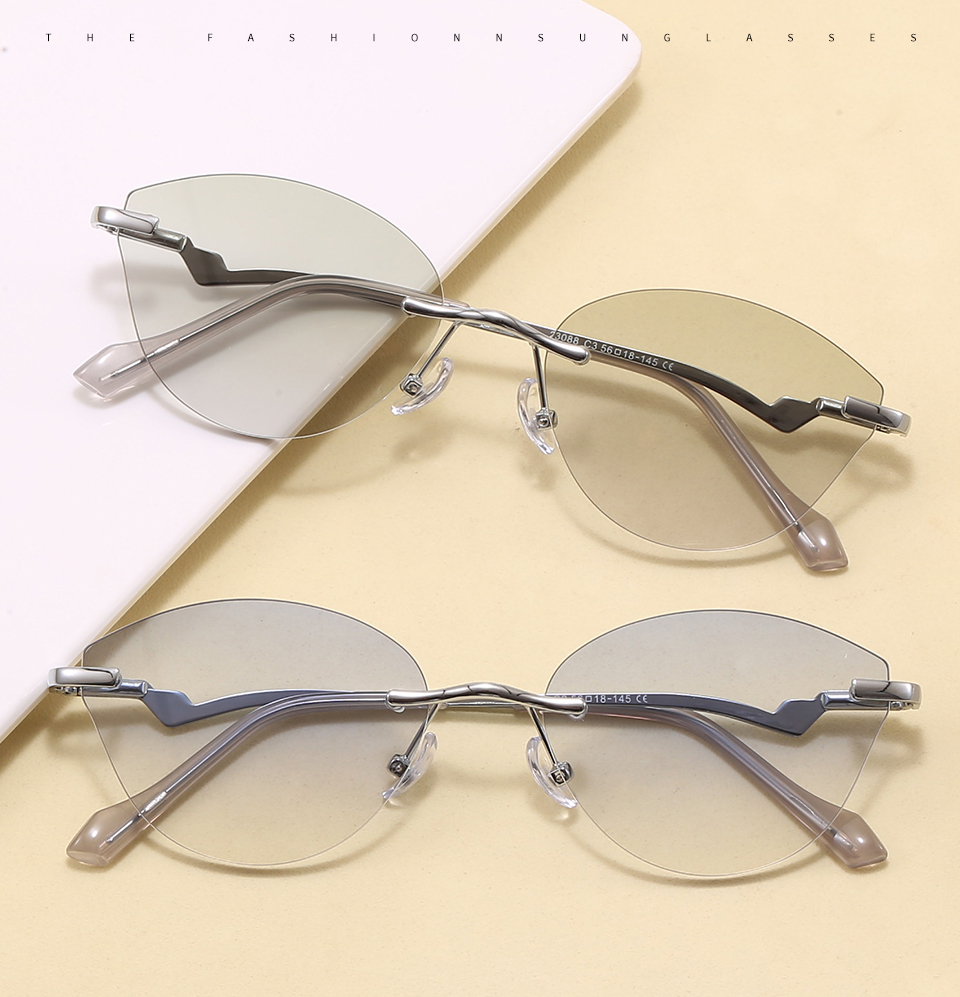 Two folded pairs in a styled tabletop display, showing the frame profile and lens colors.