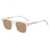 Wayfarer style sunglasses with clear frame and brown tinted lenses