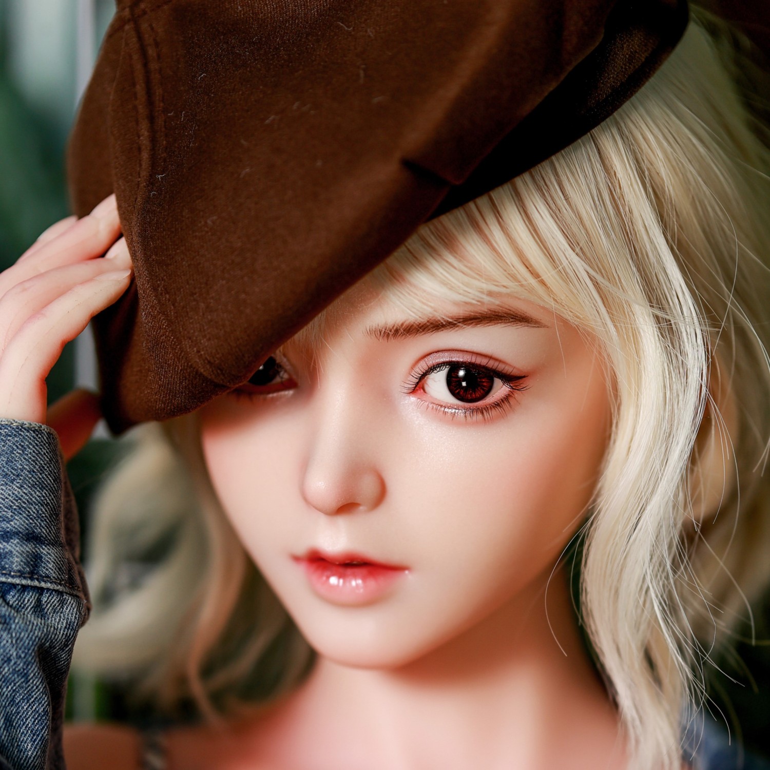 silicone-doll-with-long-hair-relaxing-on-sofa-in-lingerie-with-closed-eyes