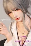 Realistic sex doll wearing black bra and panties under white button-up shirt