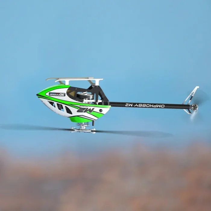 Side view of OMPHOBBY M2 V3 Sport Aurora Green RC helicopter performing side flight in air, exhibiting the 3D helicopter’s agile maneuverability and linear response
