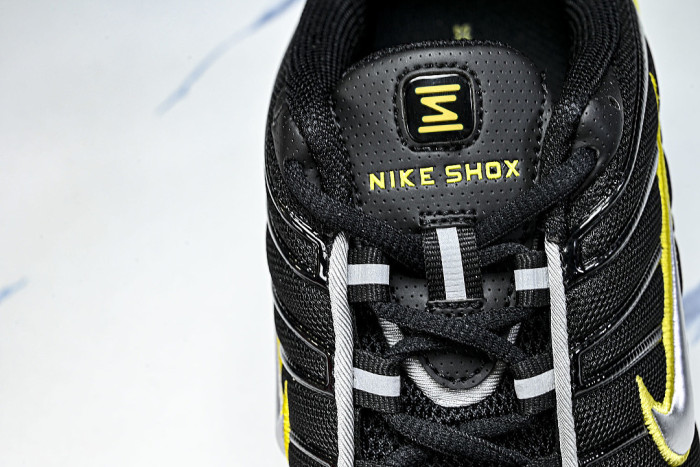 CNO151-002 SHOX TL BLACK/DYNAMIC YELLOW-METALLIC SILVER