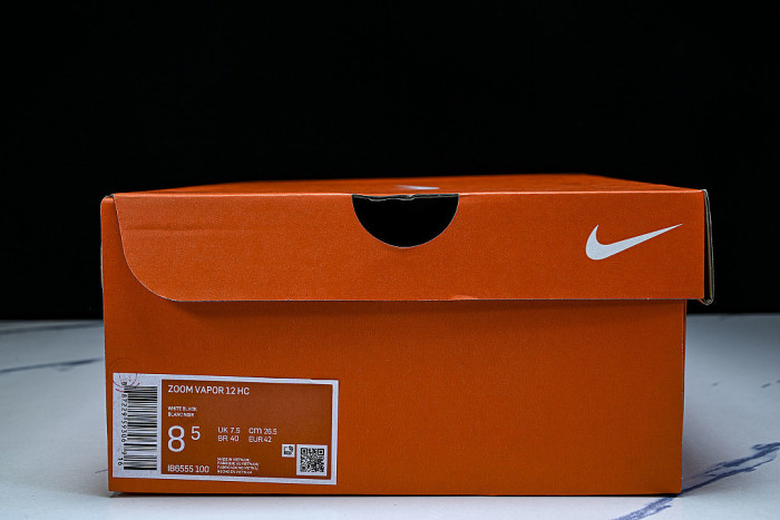 IB6555-100 COURT AIR ZOOM VAPOR 12 HC SAIL/TURF ORANGE/BLUE RIBBON HEATHER/BLACK