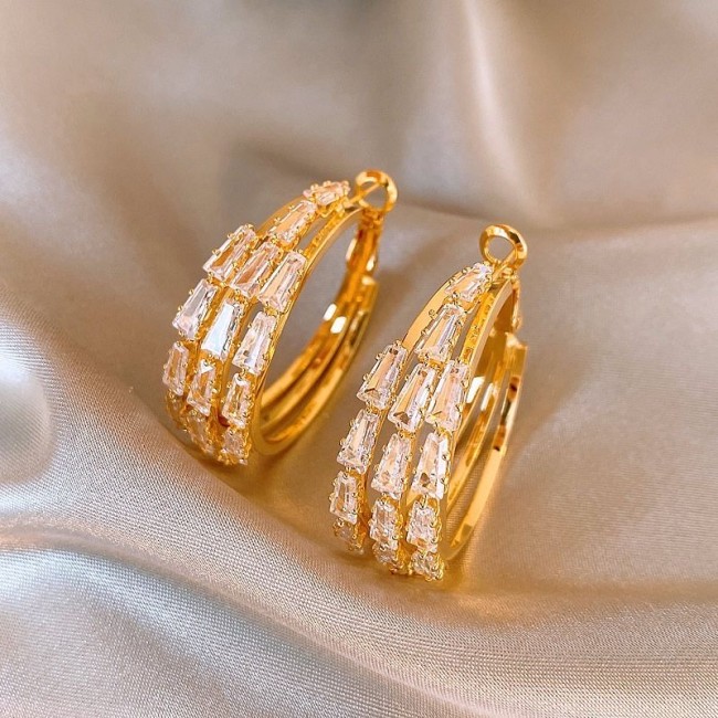 Golden zircon earrings are a popular women's item with a light luxury and high-end feel