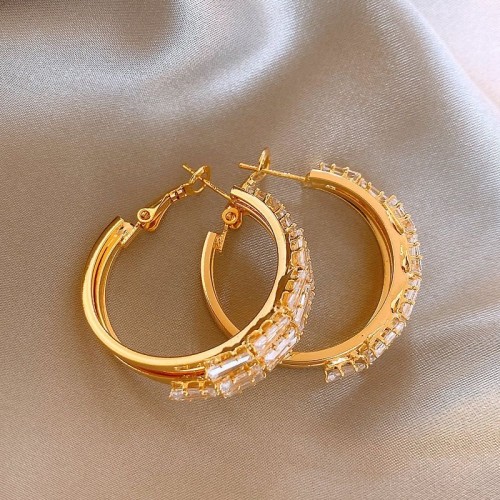 Golden zircon earrings are a popular women's item with a light luxury and high-end feel