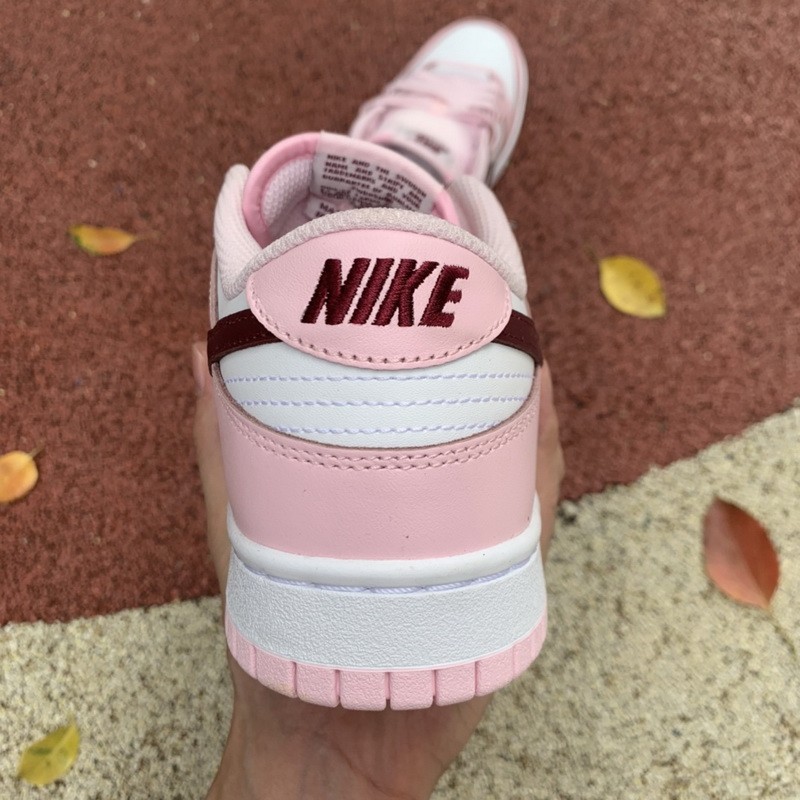 pink red and white dunks