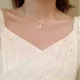 Woman with diamond butterfly necklace