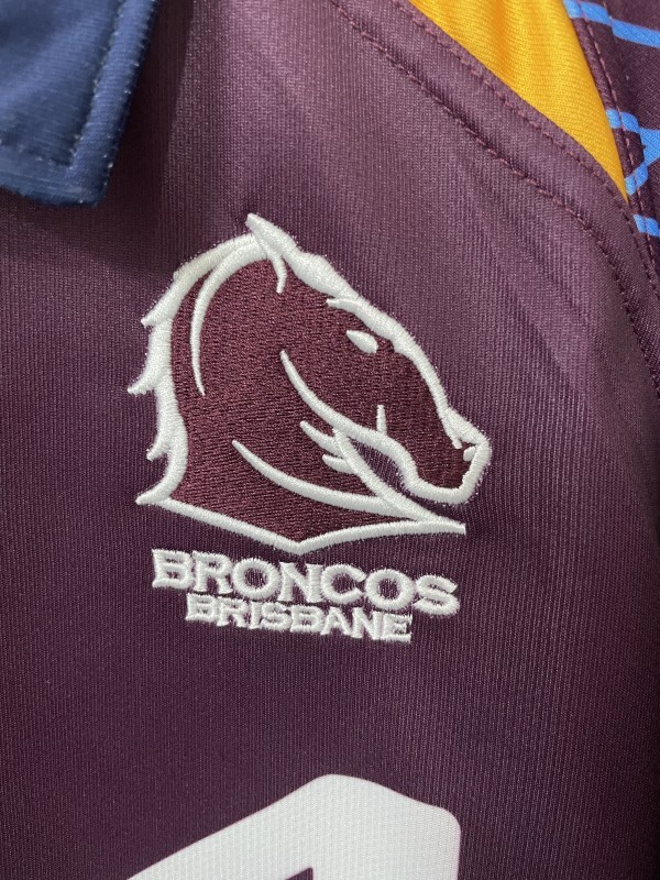 25/26 Brisbane Broncos Maroon with Blue Striped Sleeves and Gold Geometric Jersey