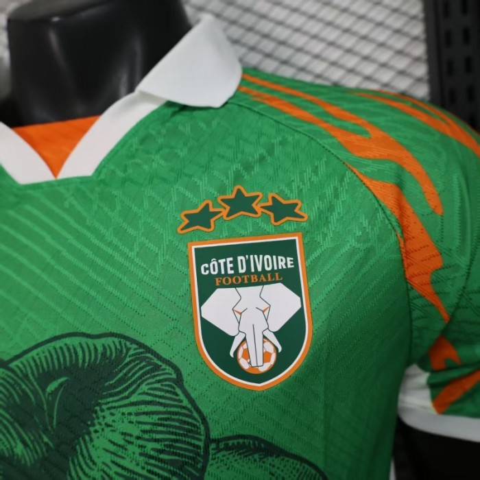 Player Version 2025 Ivory Coast Green with Elephant Graphic and Orange Trim Jersey