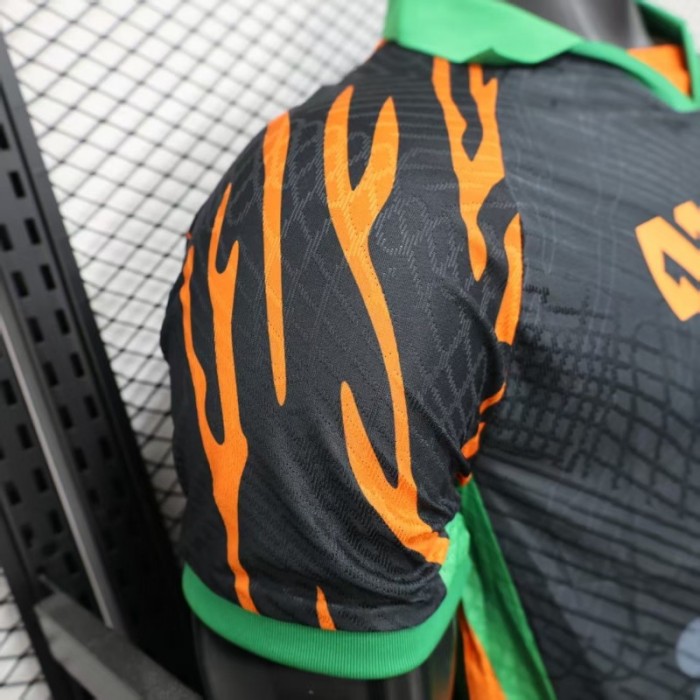 Player Version 2025 Ivory Coast Black with Elephant Graphic and Orange Stripes Jersey