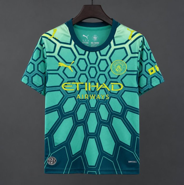 26/27 Manchester City Vibrant Green Goalkeeper Jersey With Dark Blue Geometric Pattern.