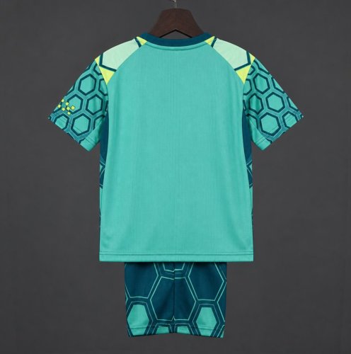 26/27 Kids Manchester City Vibrant Green Goalkeeper Jersey With Dark Blue Geometric Pattern.
