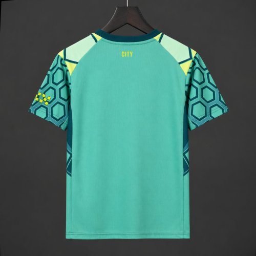 26/27 Manchester City Vibrant Green Goalkeeper Jersey With Dark Blue Geometric Pattern.