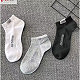 A pair of New Balance socks, random colors