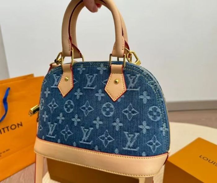 Lv blue denim shell bag.