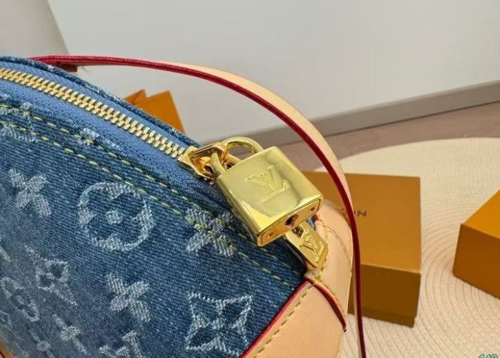 Lv blue denim shell bag.